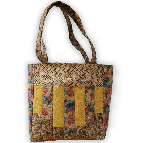 A yellow and tan tote bag made from cork fabric
